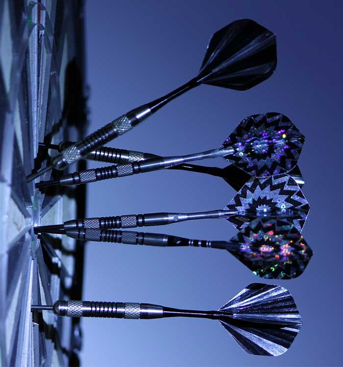 Darts clustered in the center of a dart board at Falls Bowl in Chippewa Falls WI.