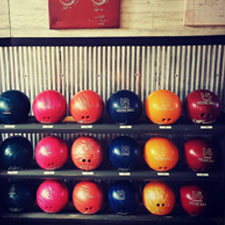 Bowling balls on rack at Falls Bowl in Chippewa Falls WI.