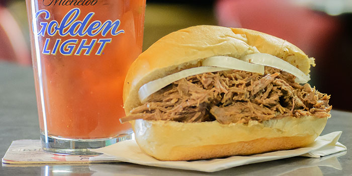 Hot beef sandwich beside a bloody mary drink served from the dinner menu at Chippewa Falls Bowl